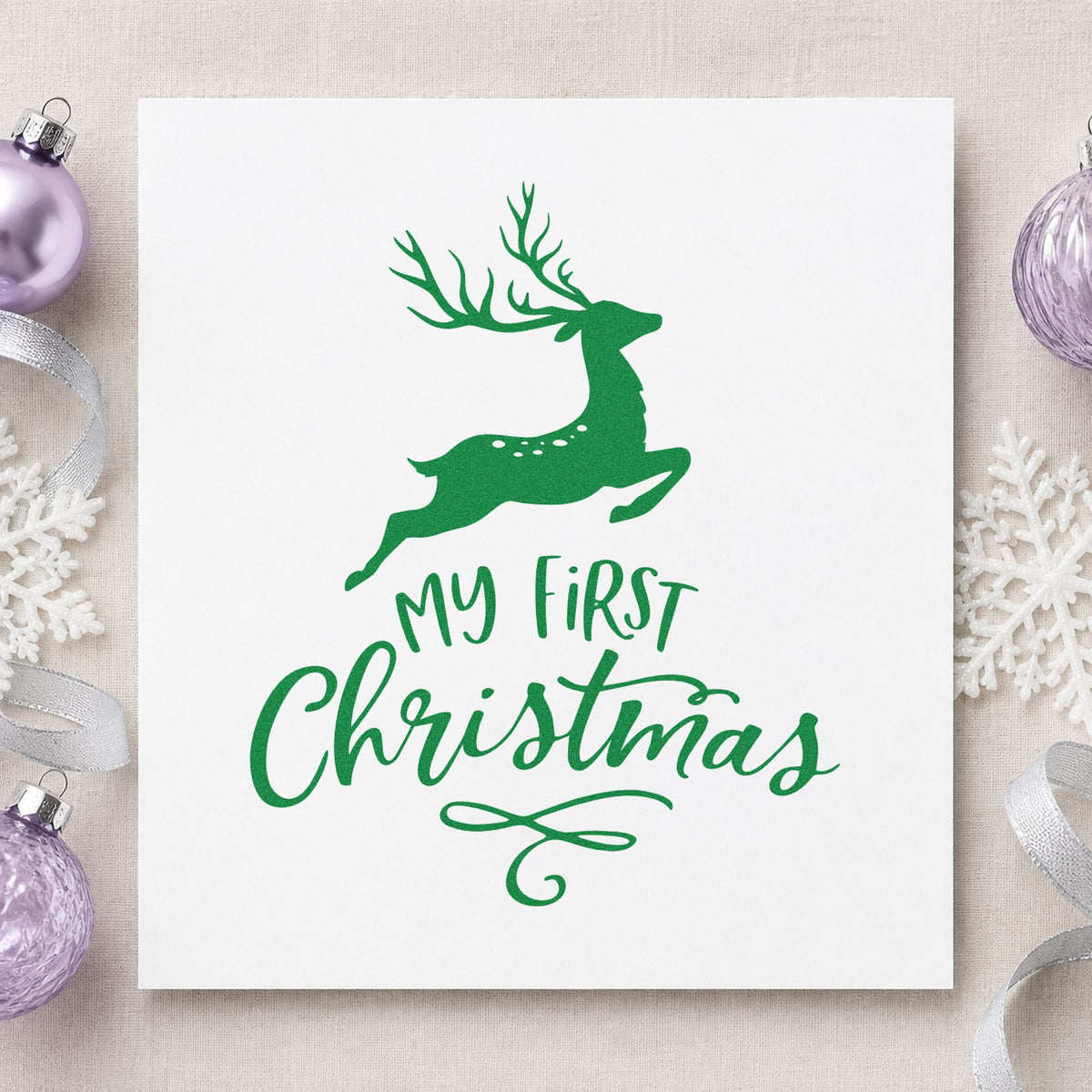 My First Christmas Reindeer craft stamp imprinted in green ink on paper, a design suited to framed woodland wall.