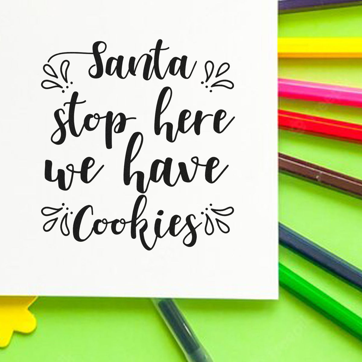 Santa Stop Here We Have Cookies Premium Wooden Stamp - Vintage Pro imprint stamped in black ink. "Santa Stop Here We Have Cookies" appears in script with decorative leaf-like accents.
