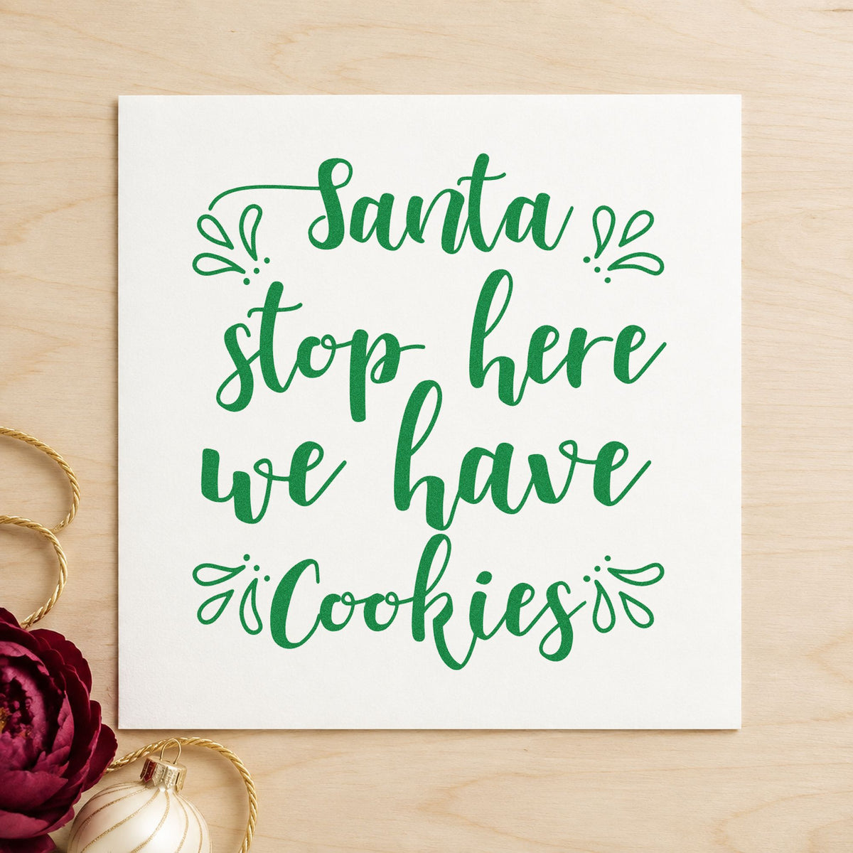 Santa Stop Here Cookies craft stamp imprint in green ink on a handmade project, one idea being plate sign gift tags.