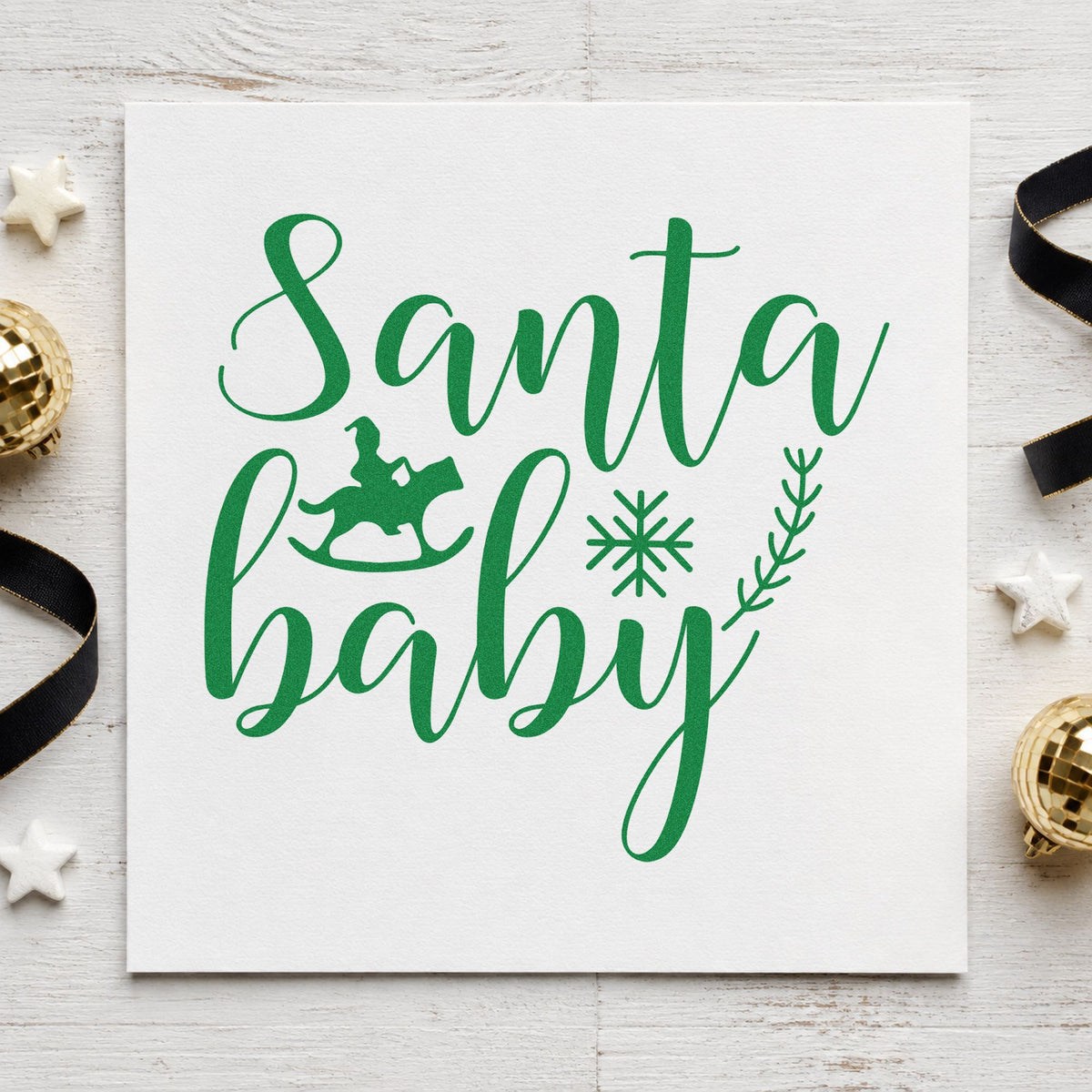 Santa Baby Rocking Horse craft stamp imprinted in green ink on paper, a design suited to framed play corner.