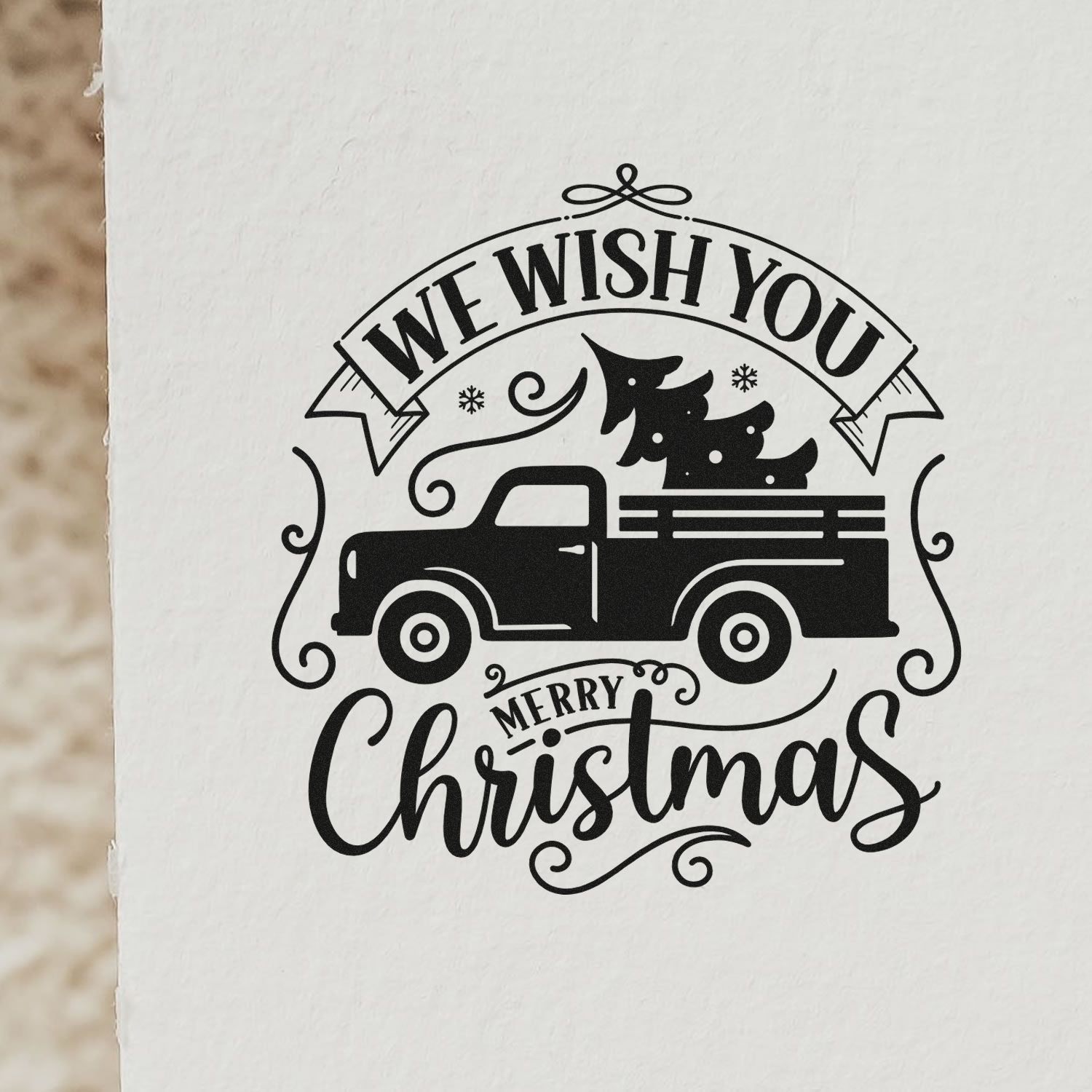 Christmas rubber stamp design with vintage pickup truck carrying a tree and We Wish You Merry Christmas holiday greeting
