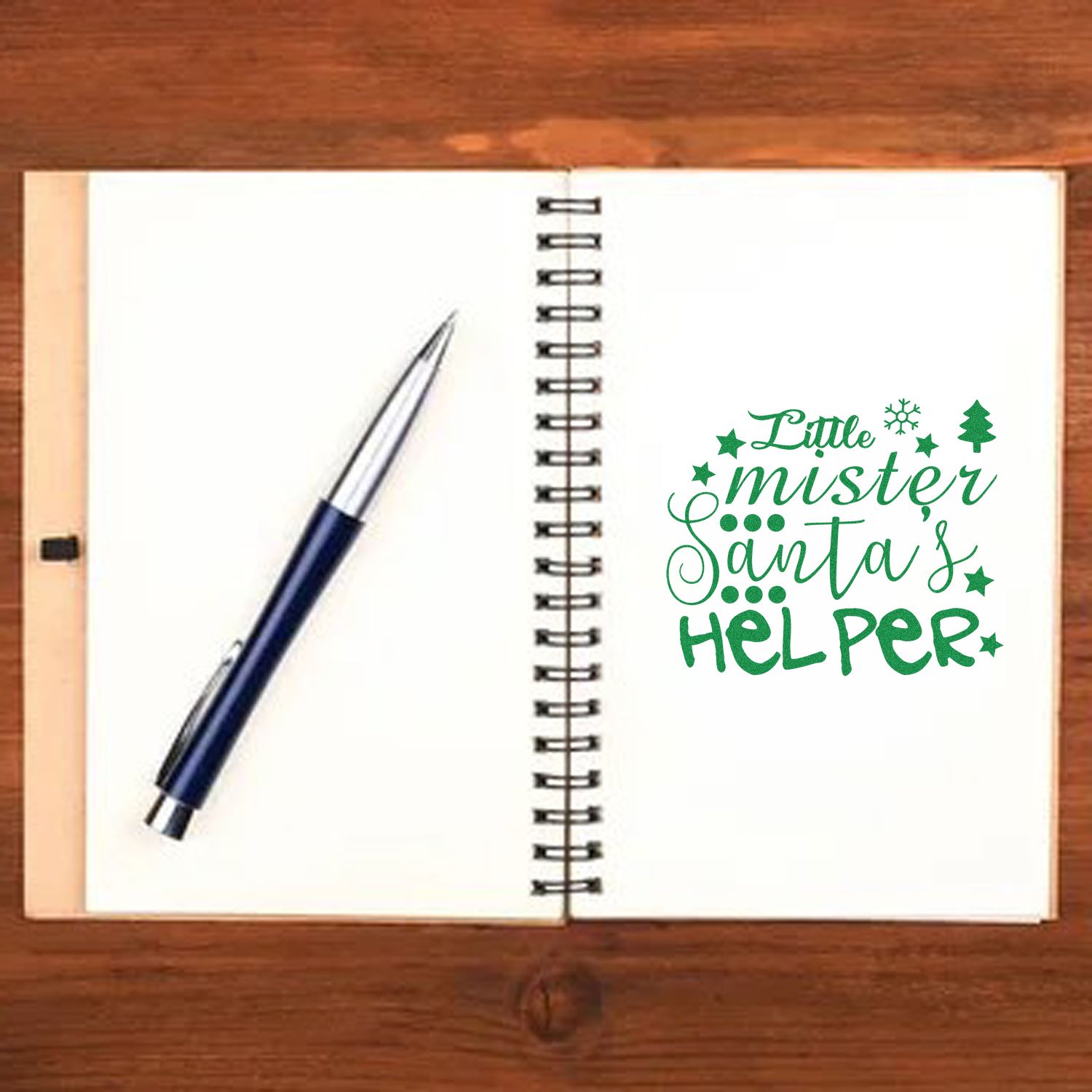 Christmas rubber stamp design with Little Mister Santas Helper on a notebook, perfect for holiday crafts and cards.