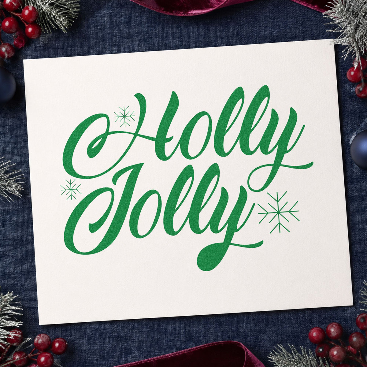 Holly Jolly Slanted Script craft stamp imprint in green ink on a handmade project, one idea being event direction cards.