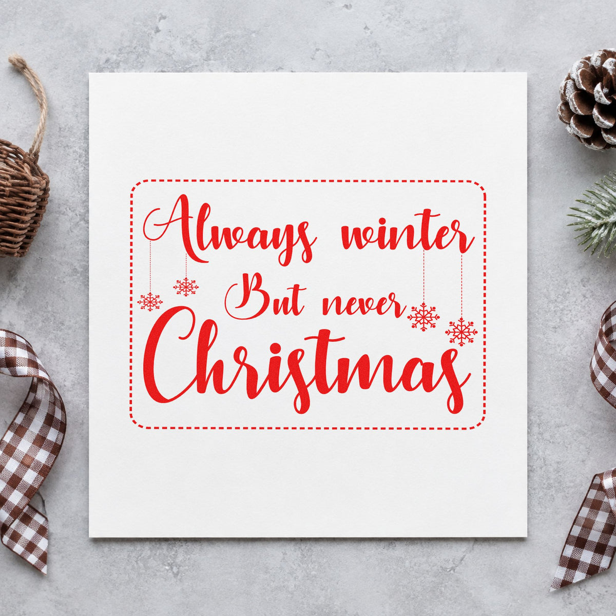 Always Winter Never Christmas craft stamp in red ink on cardstock, an easy option for book sleeve printing.