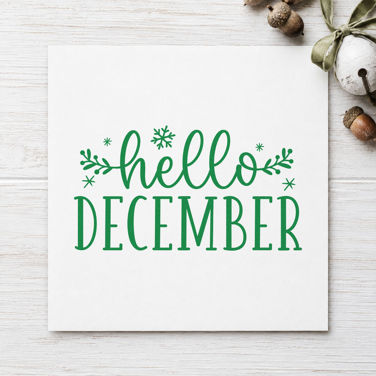 Hello December Sprigs craft stamp imprint in green ink on a handmade project, one idea being early gift tags.