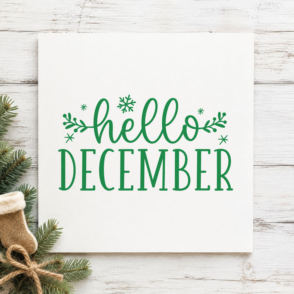 Hello December Sprigs craft stamp imprint in green ink on a handmade project, one idea being first week cards.