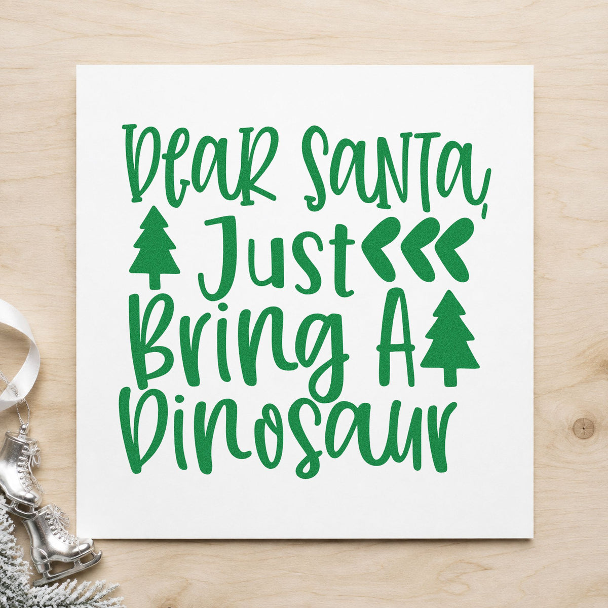 Dear Santa Bring Dinosaur craft stamp imprint in green ink on a handmade project, one idea being dig party placards.