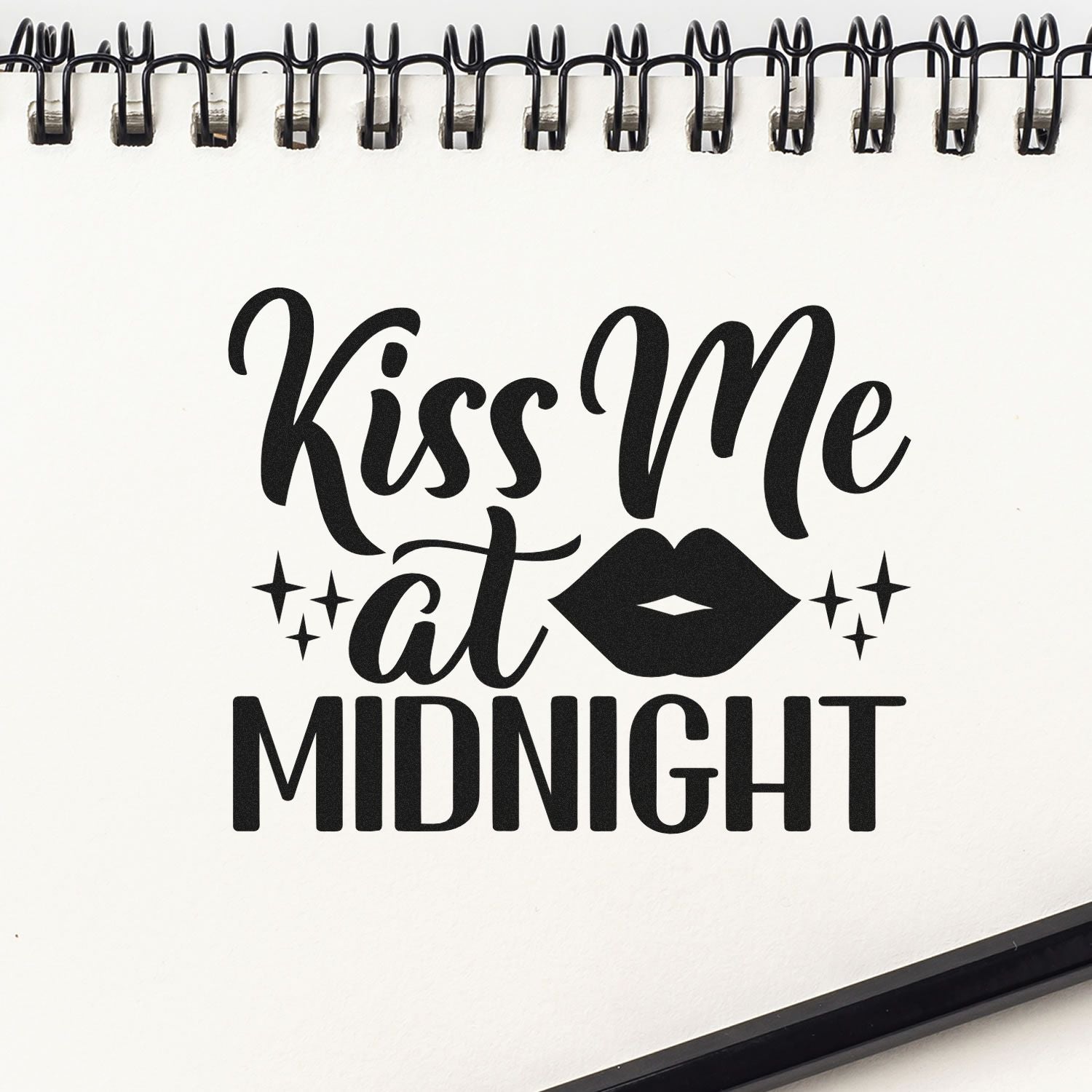 Kiss Me at Midnight rubber stamp design with lips and stars on a spiral notebook page