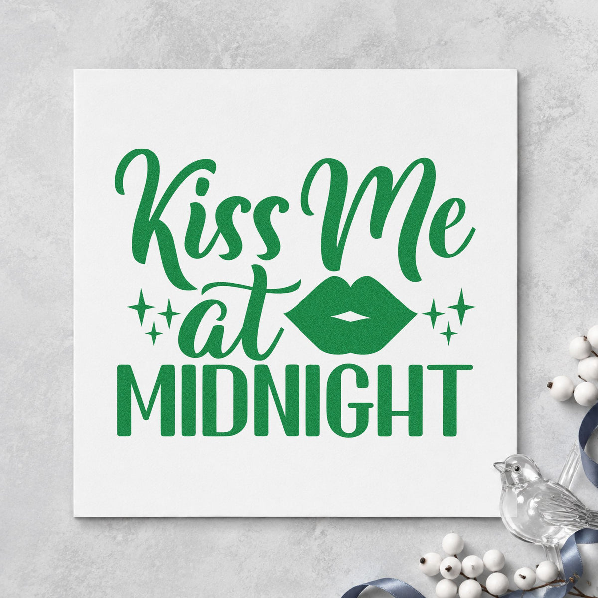 Kiss Me At Midnight craft stamp imprint in green ink on a handmade project, one idea being party favor placards.