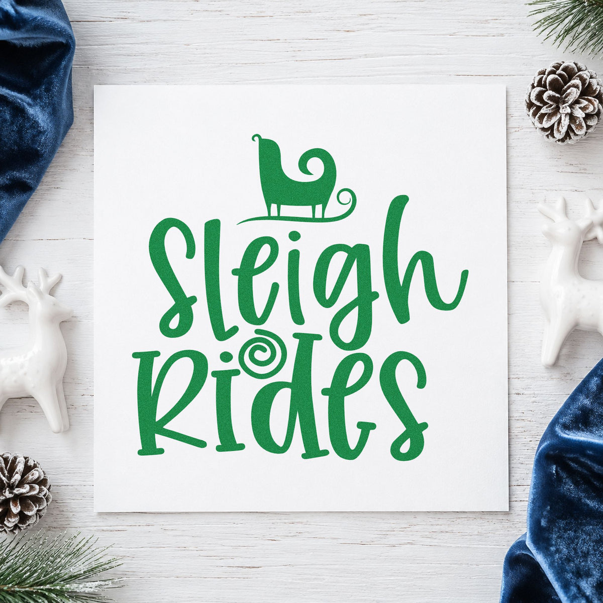 Sleigh Rides Silhouette craft stamp imprint in green ink on a handmade project, one idea being booking slip tags.
