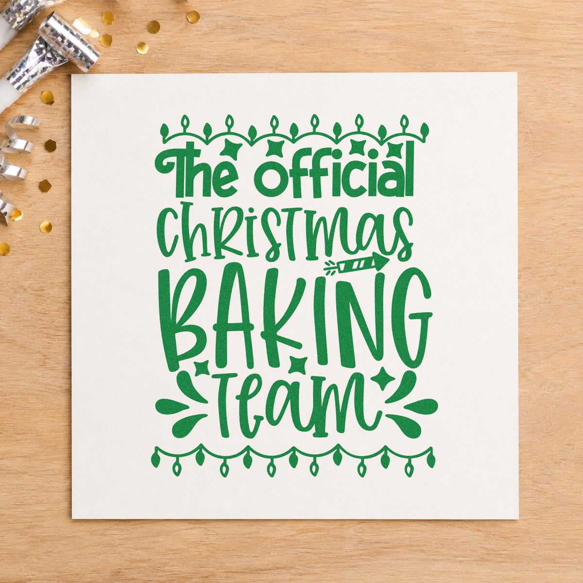 Official Christmas Baking Team craft stamp imprint in green ink on a handmade project, one idea being member badge tags.