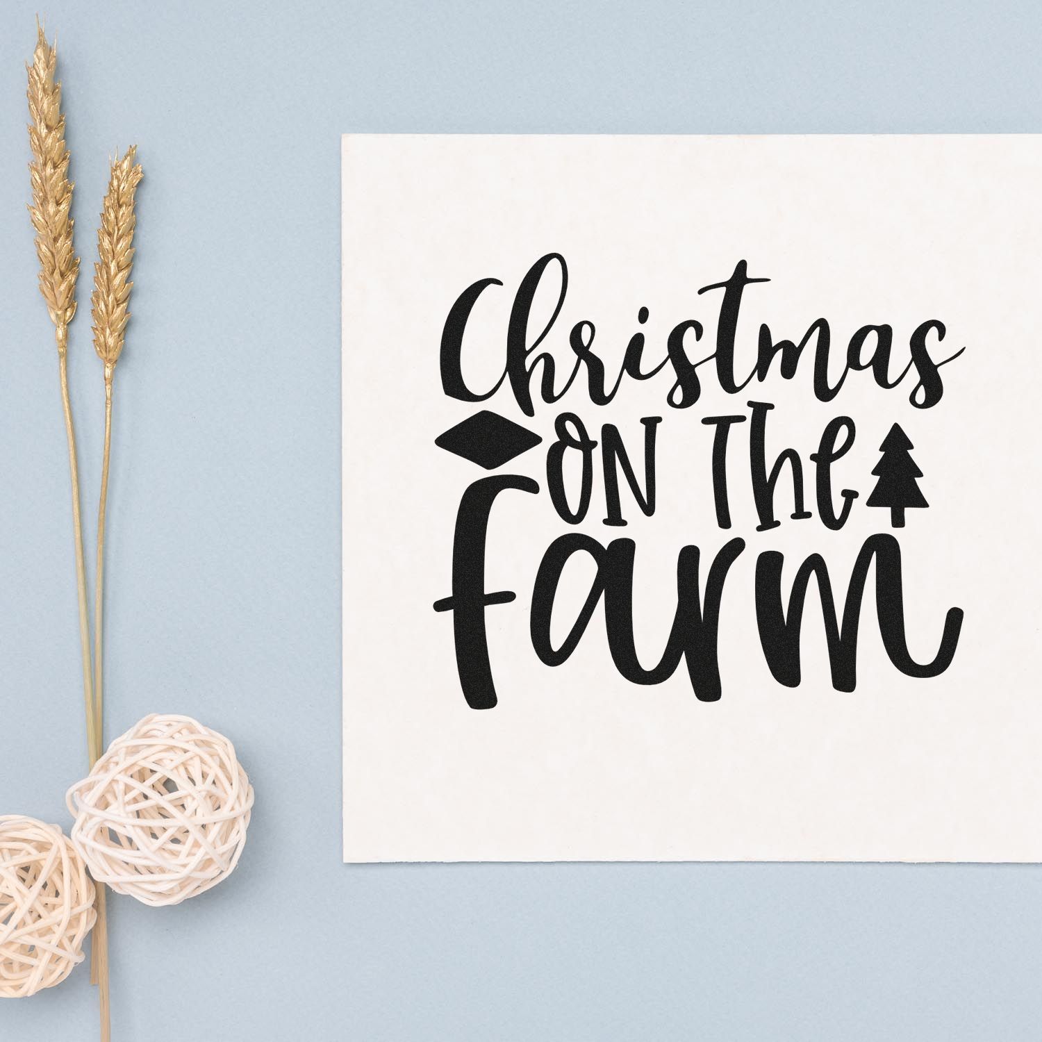 Christmas on the Farm rubber stamp design in bold script with tree icon, shown on white card with farmhouse decor.