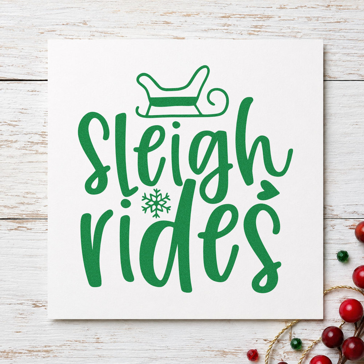 Sleigh Rides Winter Lettering craft stamp imprint in green ink on a handmade project, one idea being waiver clip tags.