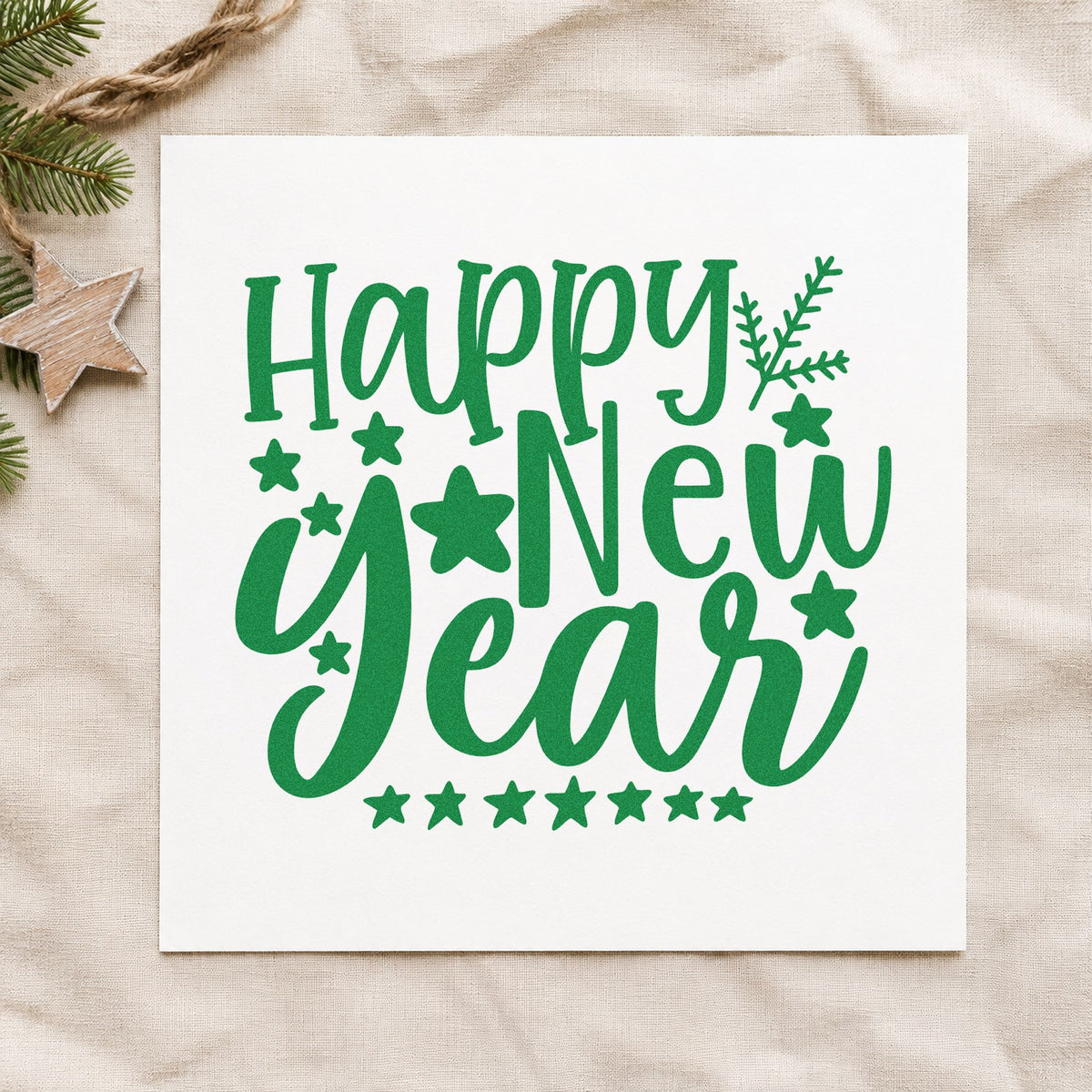 Happy New Year Stars craft stamp imprinted in green ink on paper, a design suited to framed office desk.