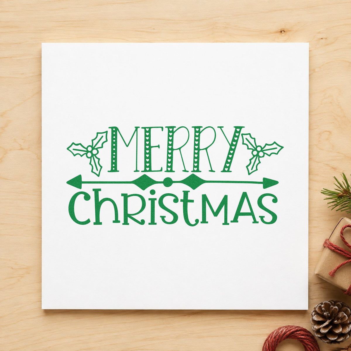 Merry Christmas Holly Banner craft stamp imprint in green ink on a handmade project, one idea being split word gift tags.