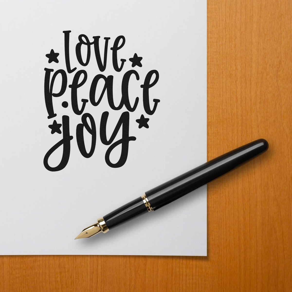 Love Peace Joy Star Accents Stamp - Premium Vintage Pro Wooden imprint stamped in black ink. The words "Love peace joy" stack vertically among solid stars.
