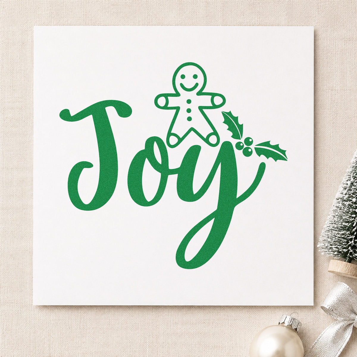 Joy Gingerbread Holly Lettering craft stamp imprinted in green ink on paper, a design suited to framed spice rack.