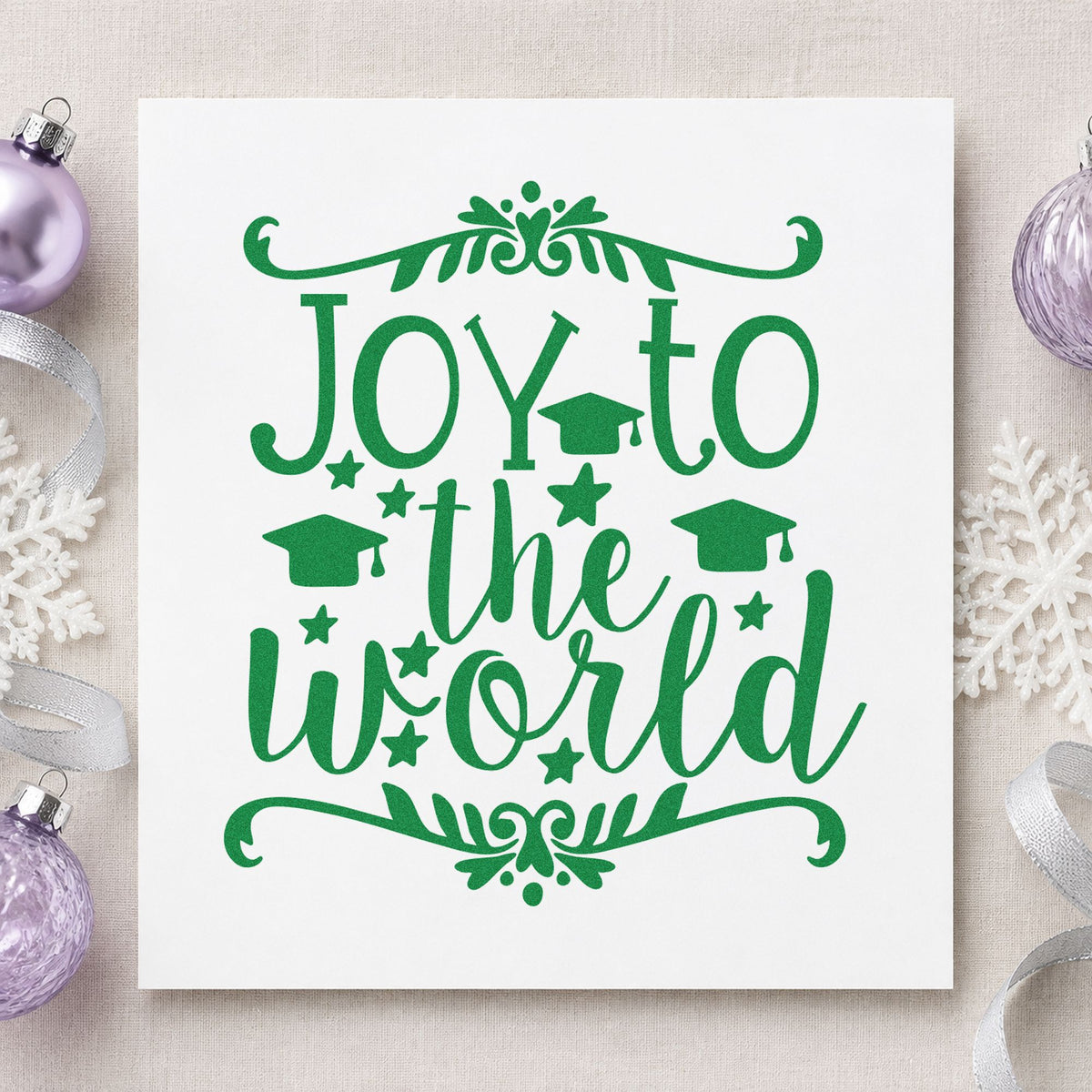 Joy To The World Flourishes craft stamp imprint in green ink on a handmade project, one idea being diploma gift tags.