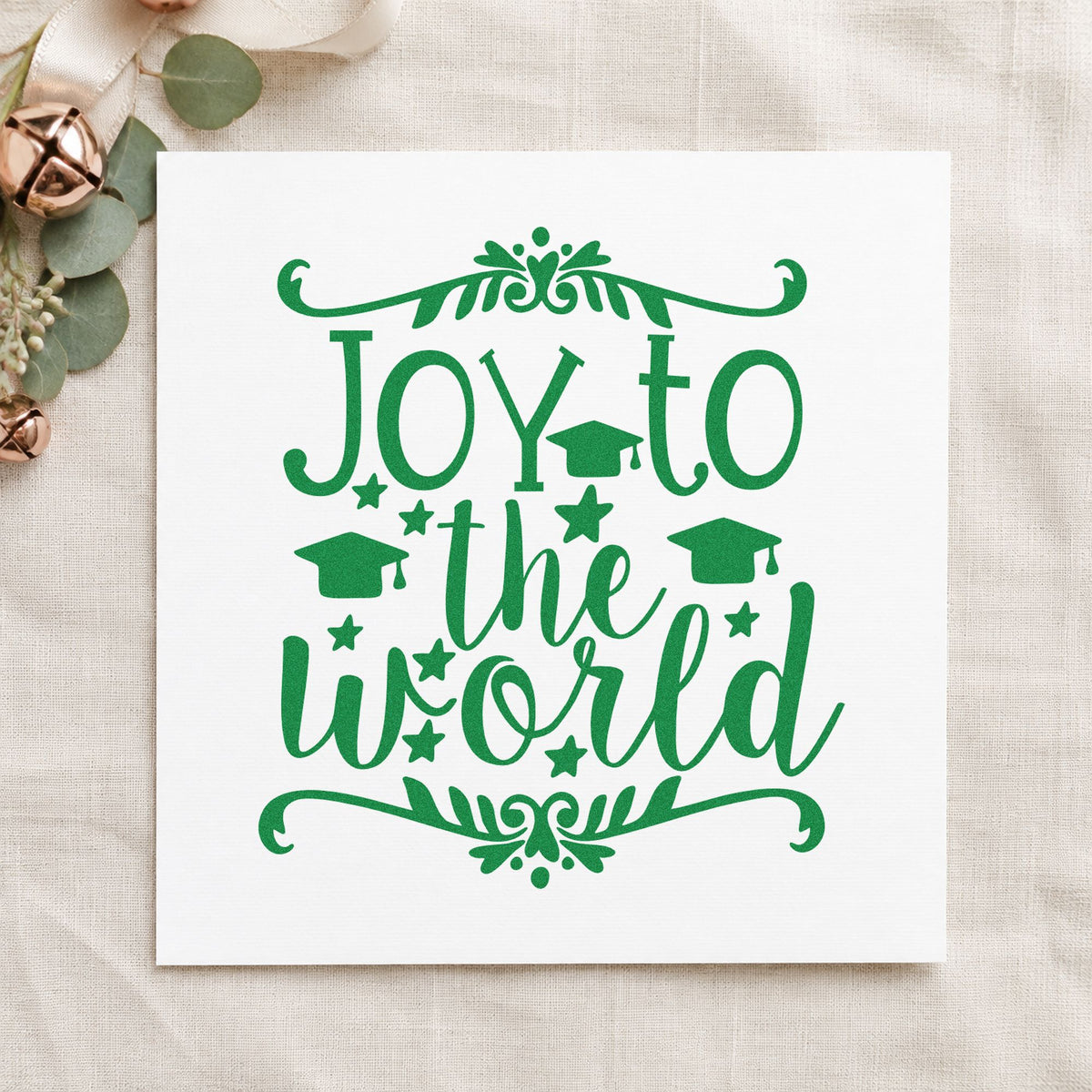 Joy To The World Flourishes craft stamp imprint in green ink on a handmade project, one idea being party invite cards.