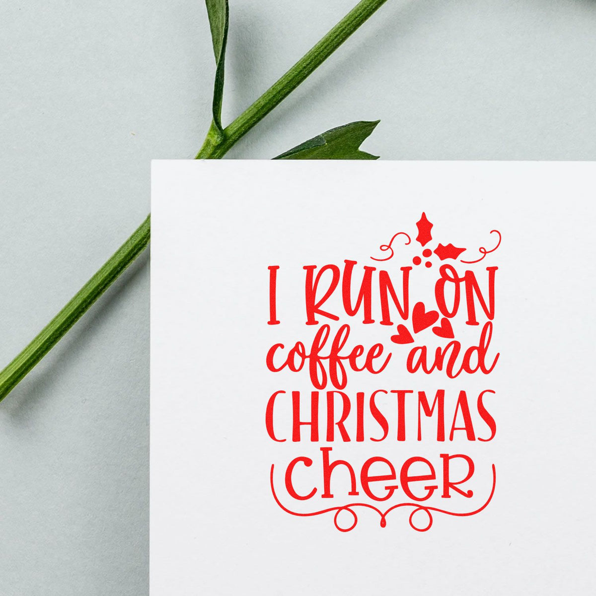 Coffee And Christmas Cheer rubber stamp shown in red ink, stamped for projects such as break room album.