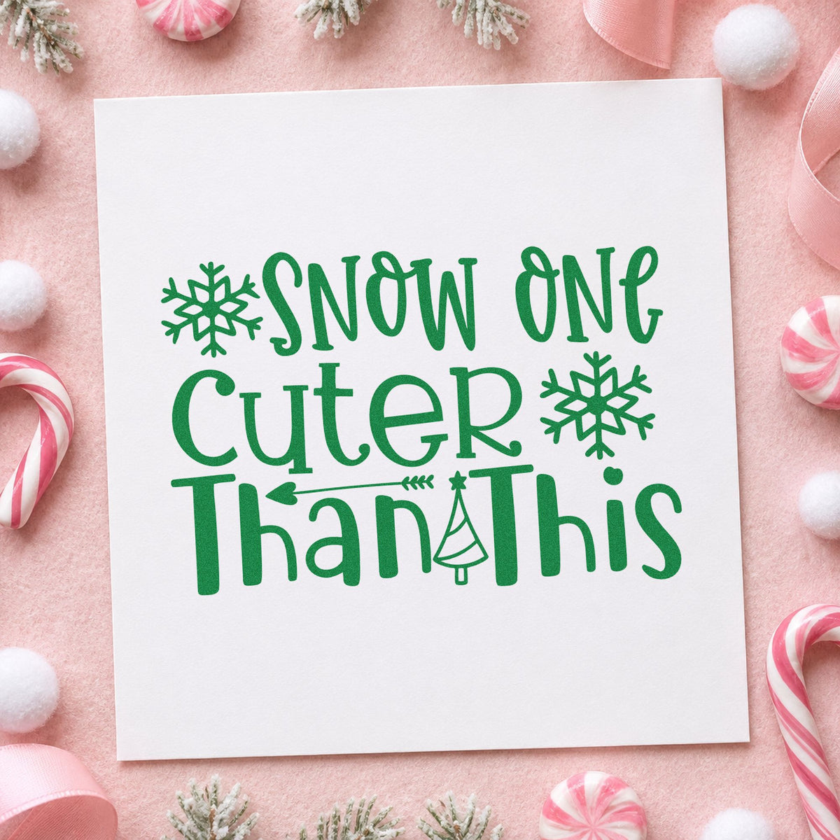 Snow One Cuter Than This craft stamp imprint in green ink on a handmade project, one idea being photo print tags.