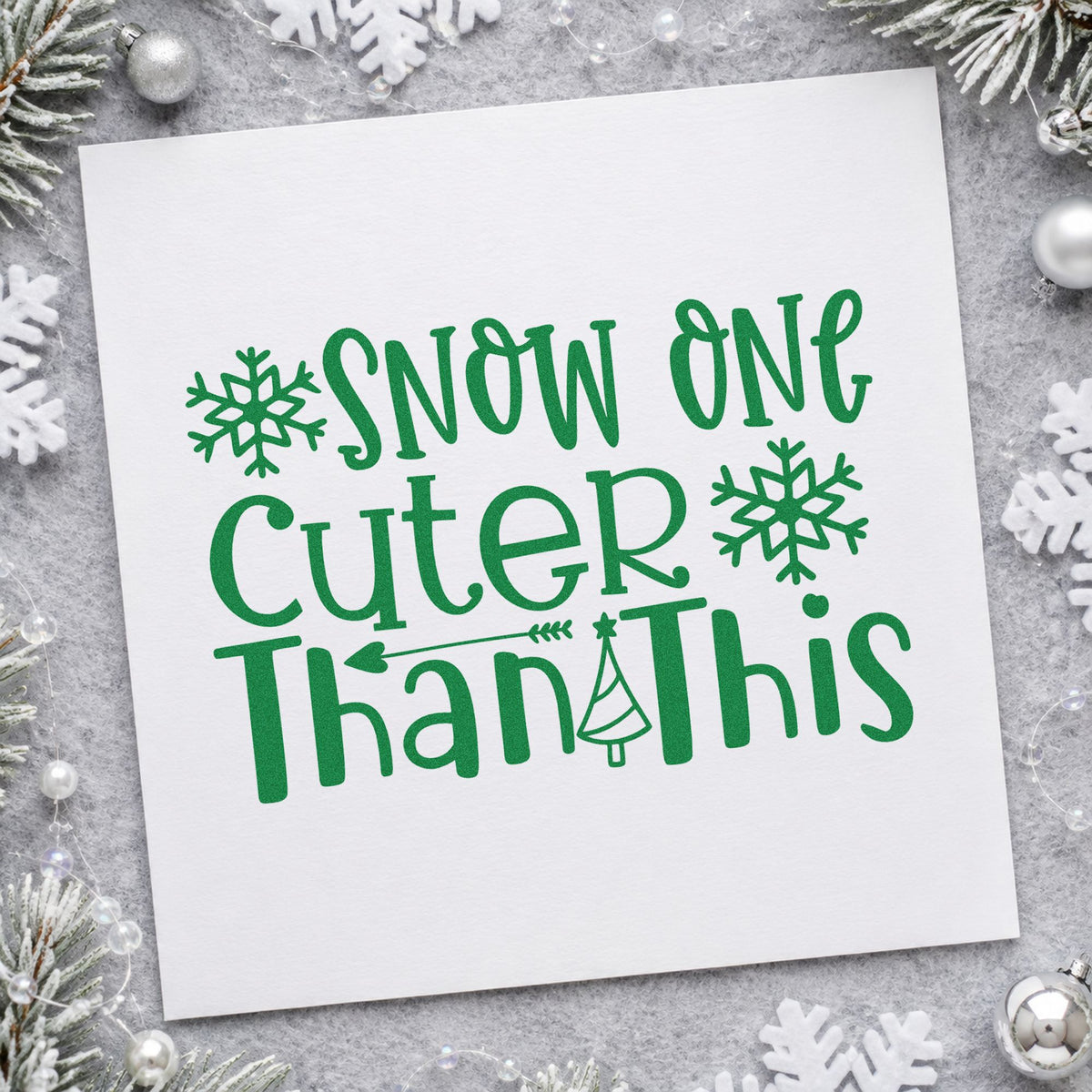 Snow One Cuter Than This craft stamp imprinted in green ink on paper, a design suited to framed photo ledge.
