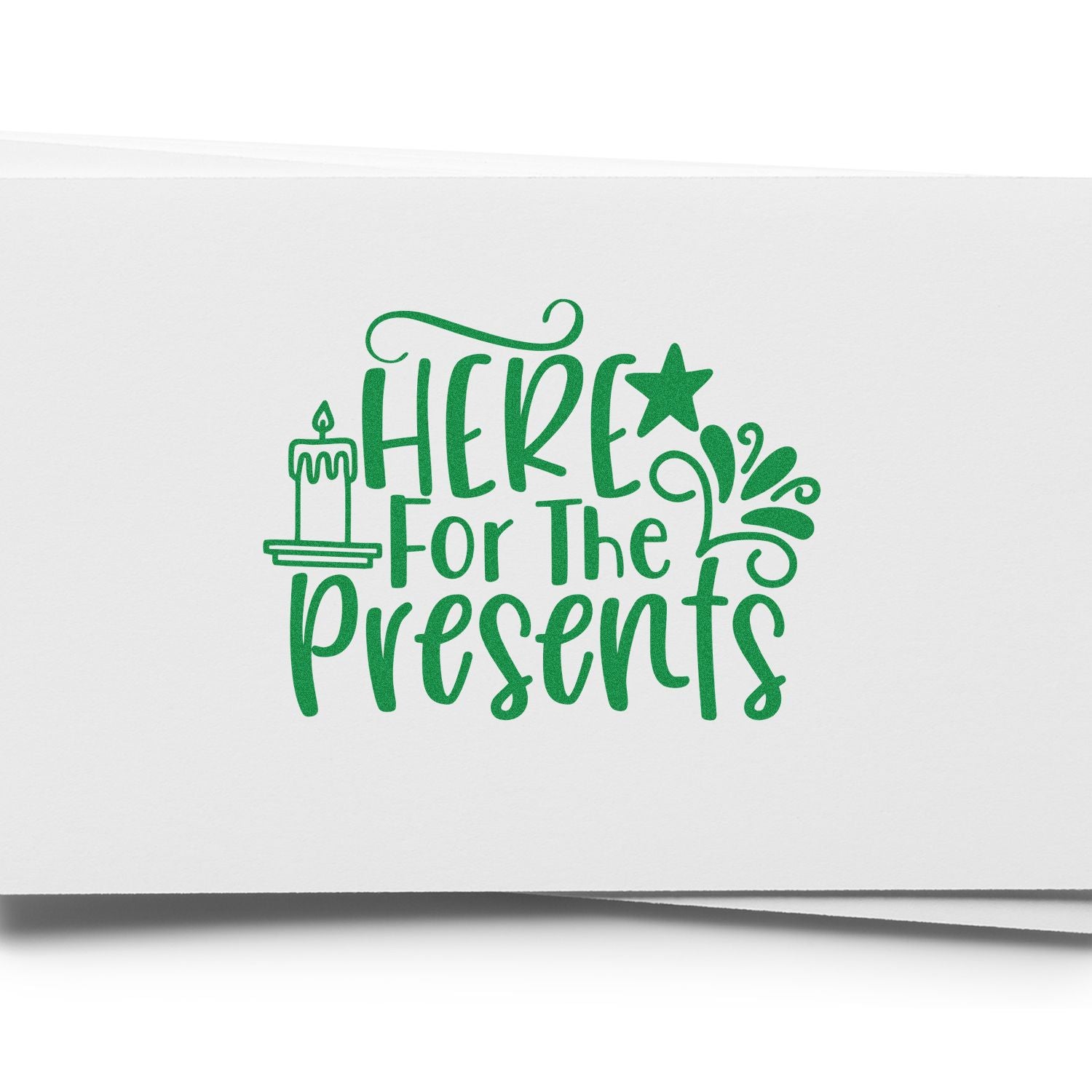Christmas rubber stamp design reading Here for the Presents with candle and star accents for gift wrap.