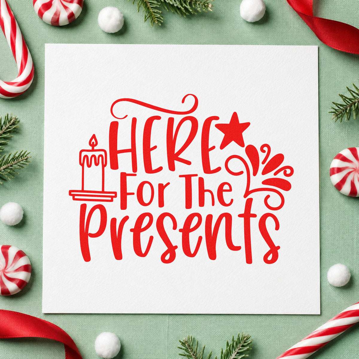 Here For The Presents craft stamp in red ink on cardstock, an easy option for tote face printing.