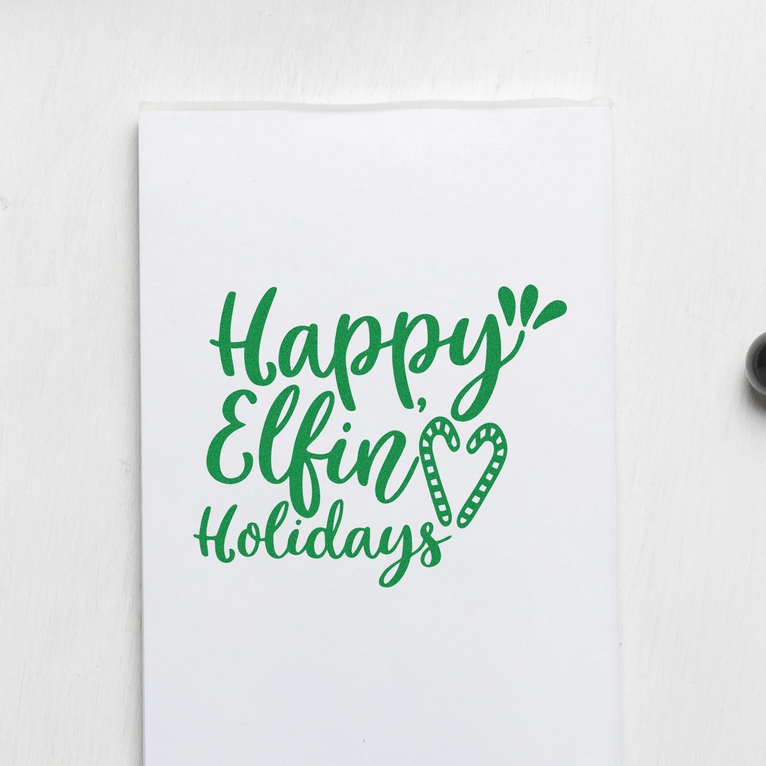 Happy Elfin Holidays rubber stamp on white card with green lettering and candy cane heart for Christmas crafting