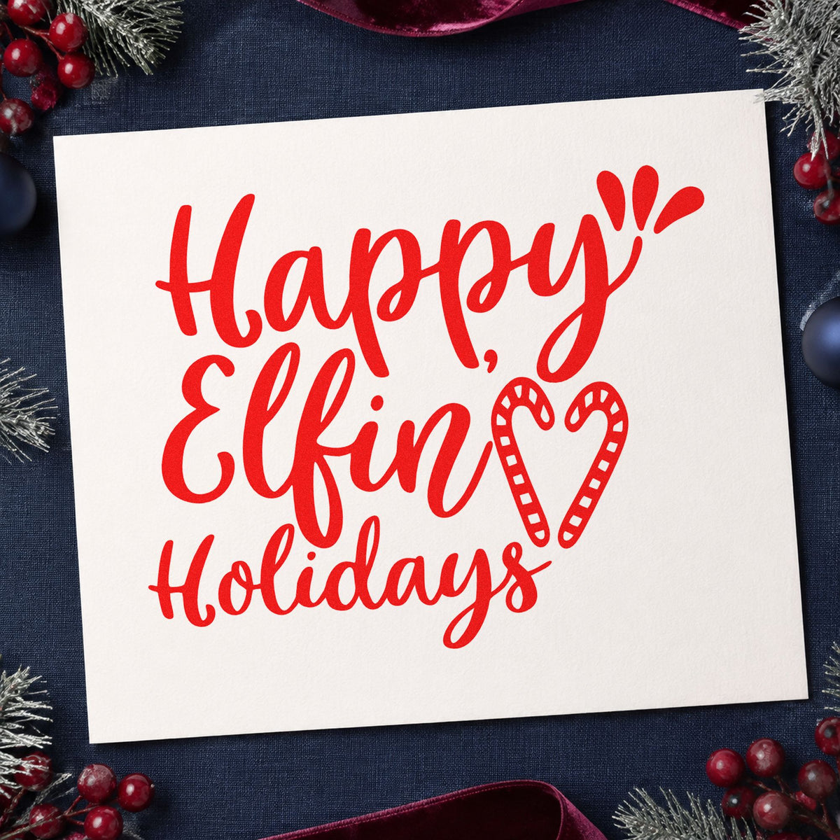 Happy Elfin Holidays Heart craft stamp in red ink on cardstock, an easy option for striped tee printing.