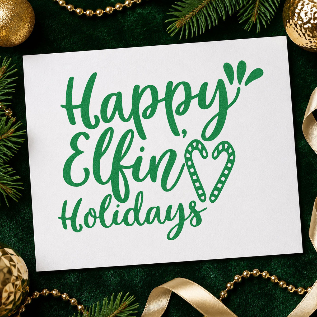 Happy Elfin Holidays Heart craft stamp imprinted in green ink on paper, a design suited to framed workshop door.