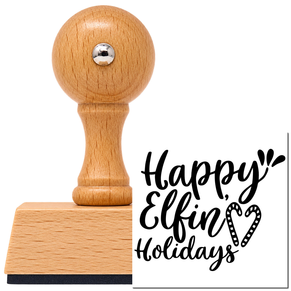 Happy Elfin Holidays Vintage Pro rubber stamp in European beech wood with a round knob handle, shown beside its black imprint.