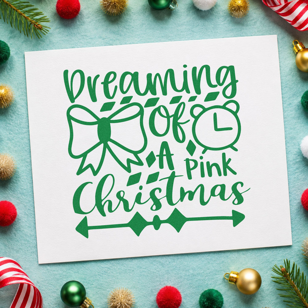 Dreaming Of A Pink Christmas craft stamp imprint in green ink on a handmade project, one idea being blush ribbon tags.