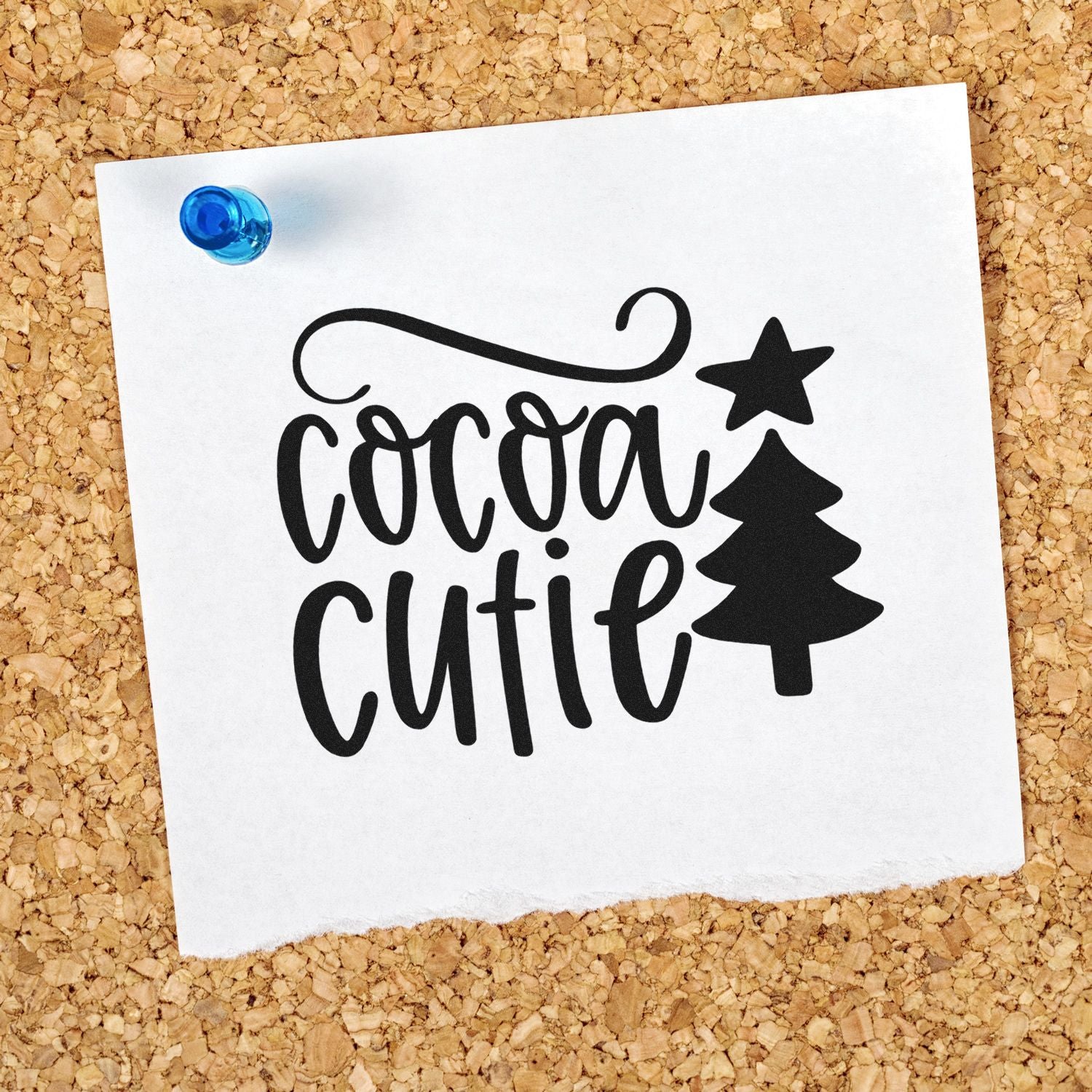 Cocoa Cutie holiday rubber stamp design with tree and star, shown on pinned paper for Christmas card making.
