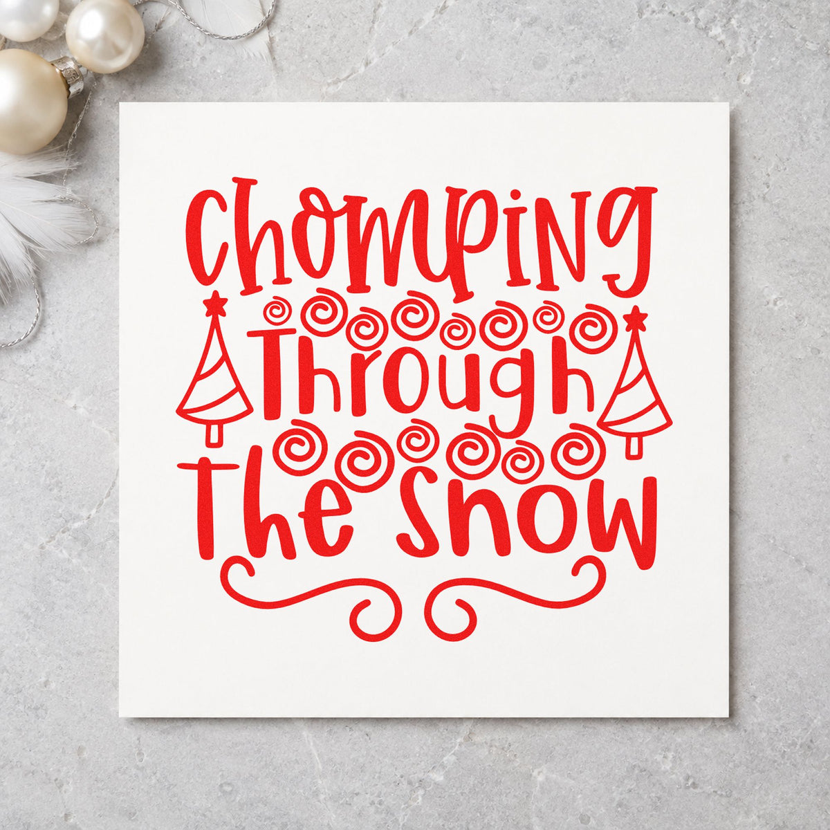 Chomping Through The Snow rubber stamp shown in red ink, stamped for projects such as scoop jar labels.