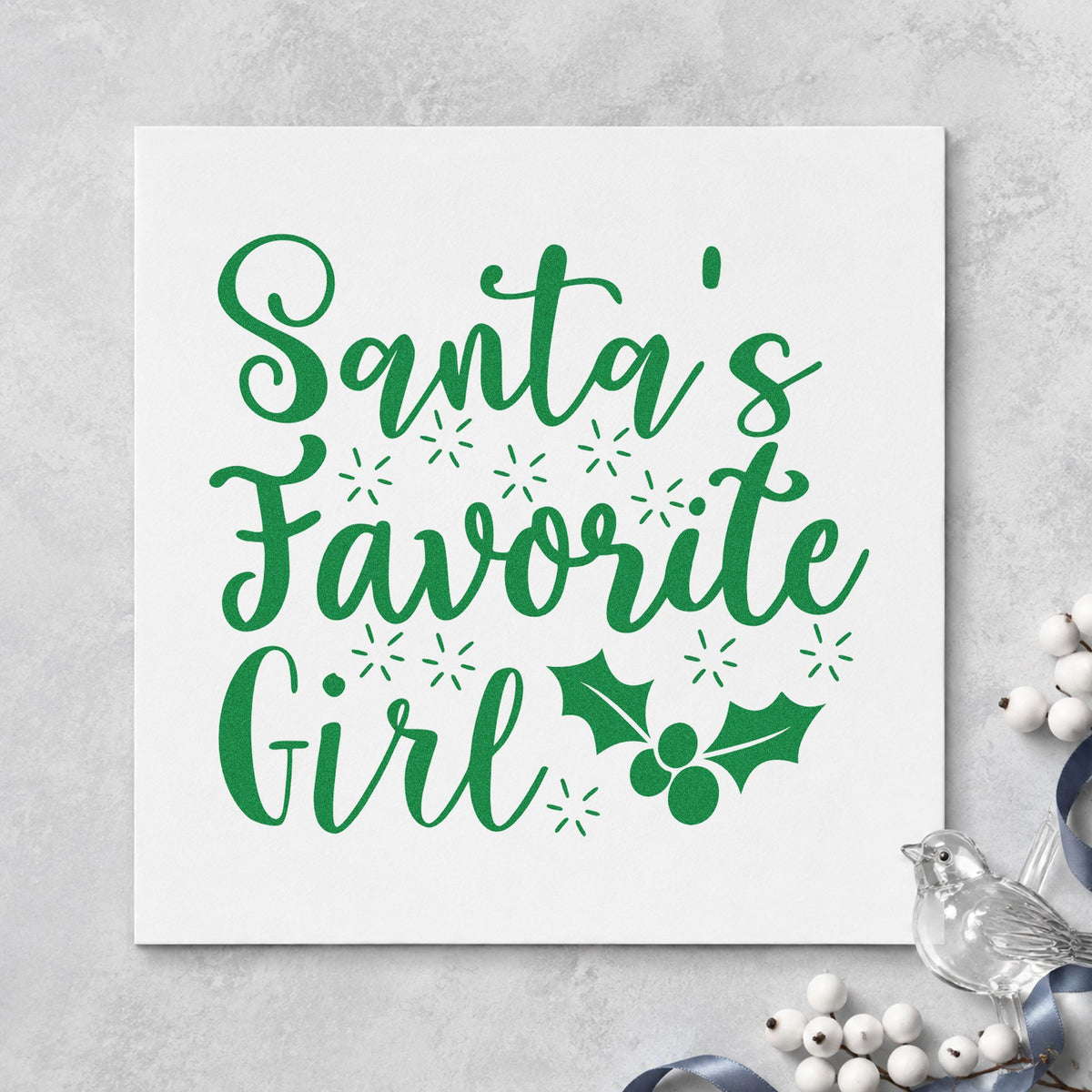 Santa's Favorite Girl Holly craft stamp imprinted in green ink on paper, a design suited to framed bedroom door.