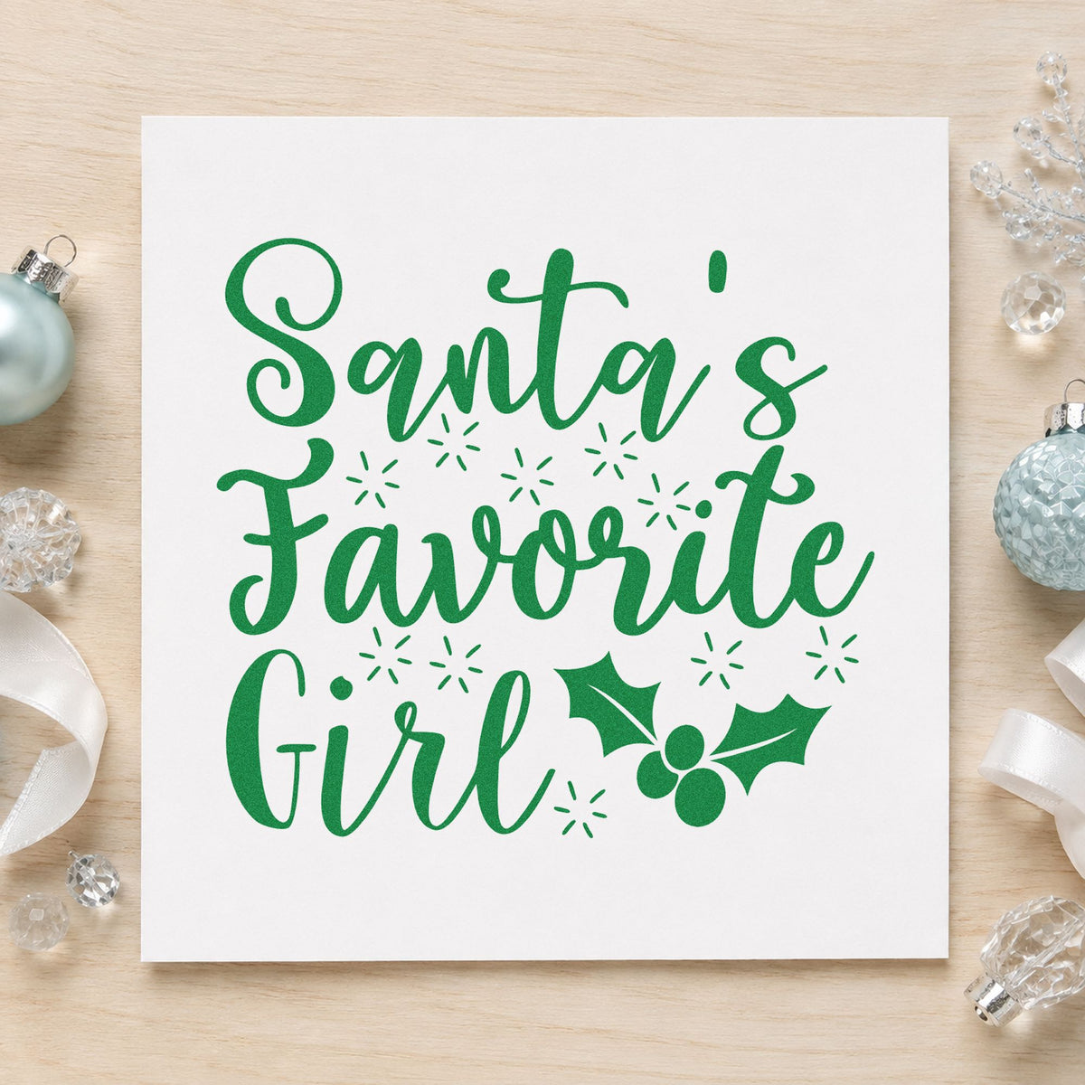 Santa's Favorite Girl Holly craft stamp imprint in green ink on a handmade project, one idea being tea party cards.