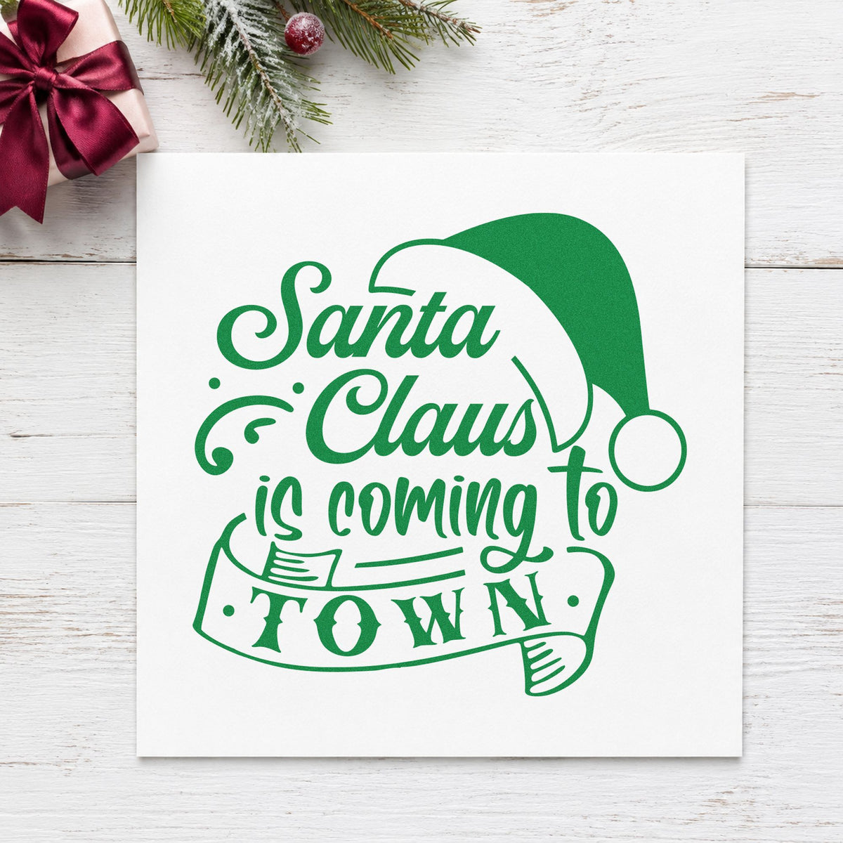 Santa Claus Coming To Town craft stamp imprinted in green ink on paper, a design suited to framed mall backdrop.