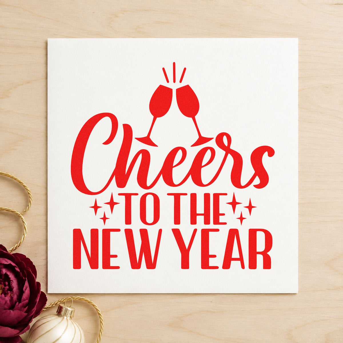 Cheers To The New Year rubber stamp shown in red ink, stamped for projects such as bottle chill labels.