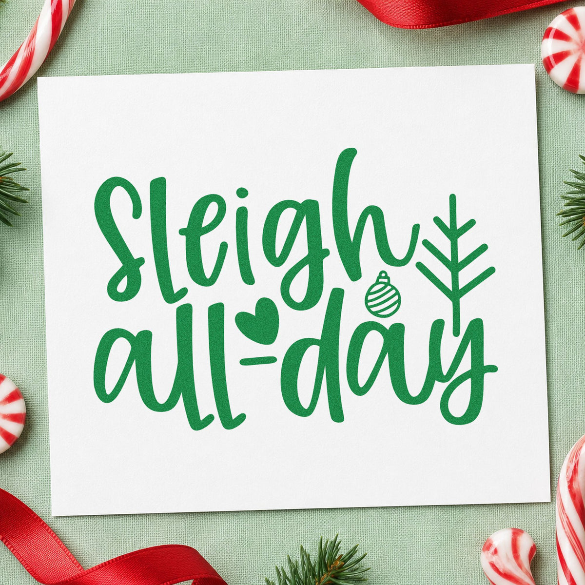 Sleigh All Day Arrow craft stamp imprint in green ink on a handmade project, one idea being pop up table cards.