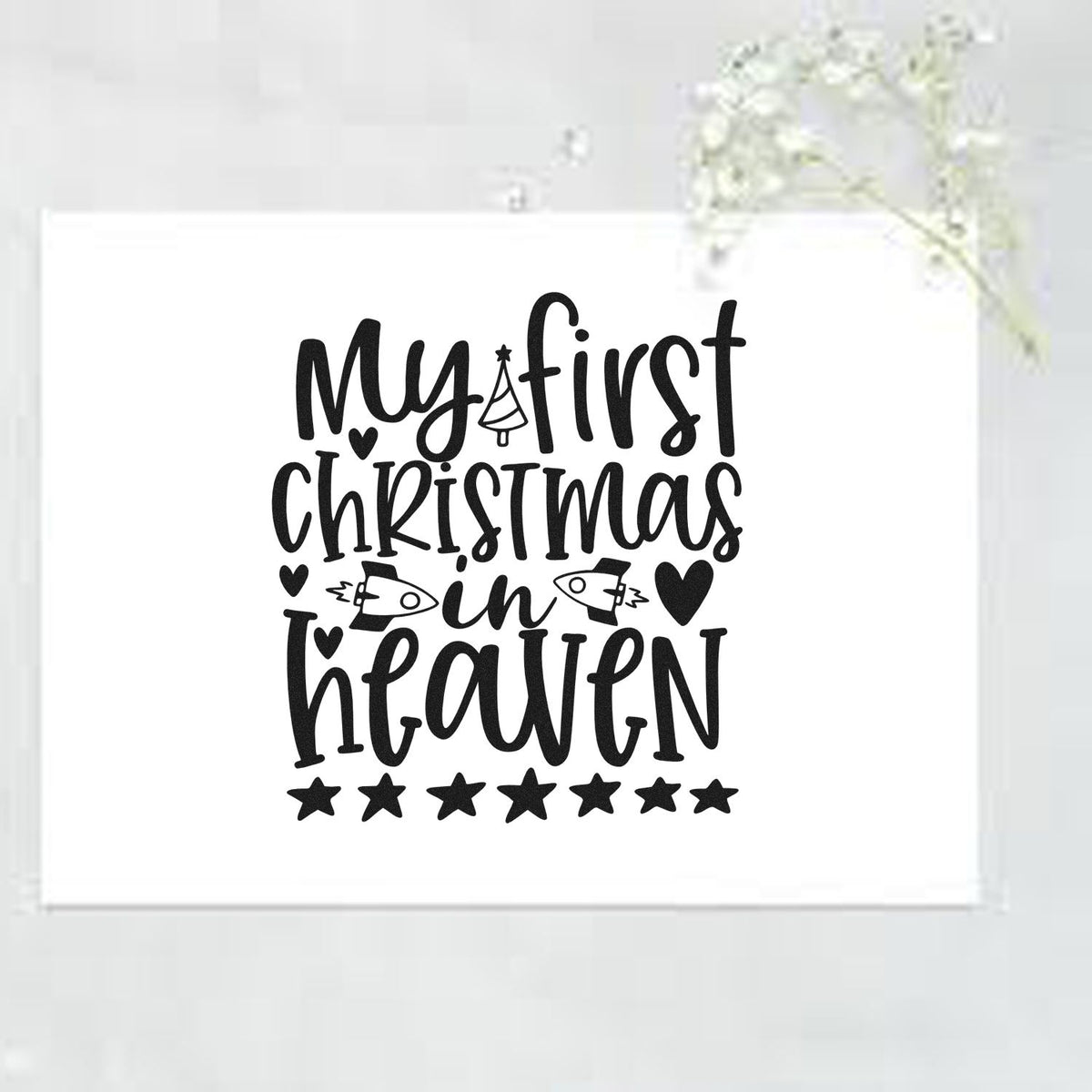 My First Christmas In Heaven Tree Motif Premium Wooden Stamp - Vintage Pro imprint stamped in black ink. The phrase "My first Christmas in heaven" includes a little tree, birds, hearts, and a row of stars.