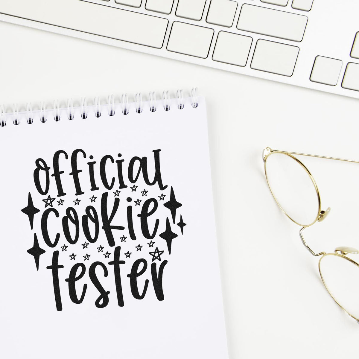 Vintage Pro Official Cookie Tester Stars Premium Wooden Stamp imprint stamped in black ink. The words "Official cookie tester" are surrounded by stars and sparkling diamond shapes.