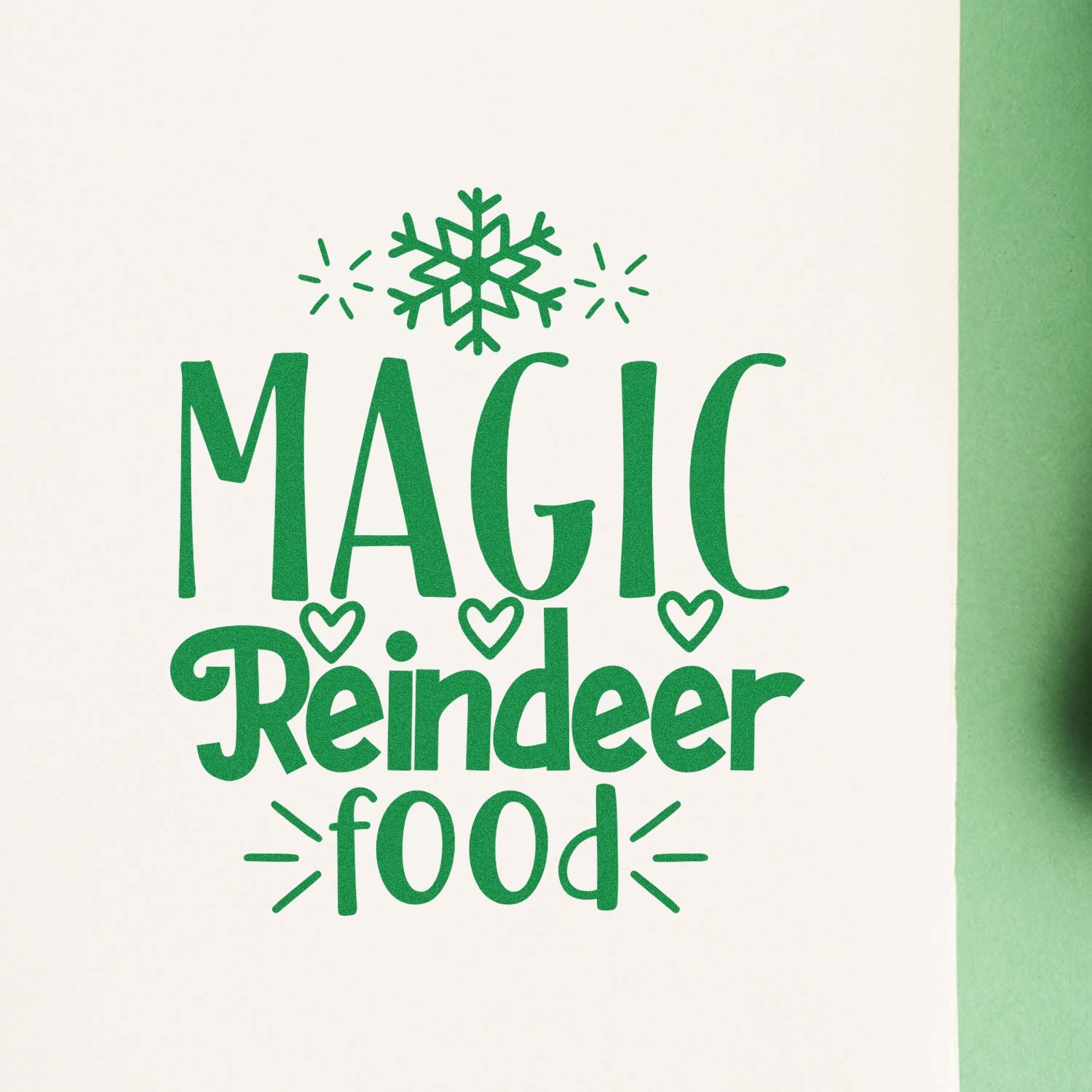 Magic Reindeer Food Christmas rubber stamp design with snowflake and heart accents in green.