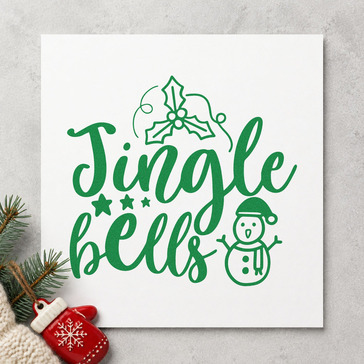Jingle Bells Holly Snowman craft stamp imprinted in green ink on paper, a design suited to framed front step.