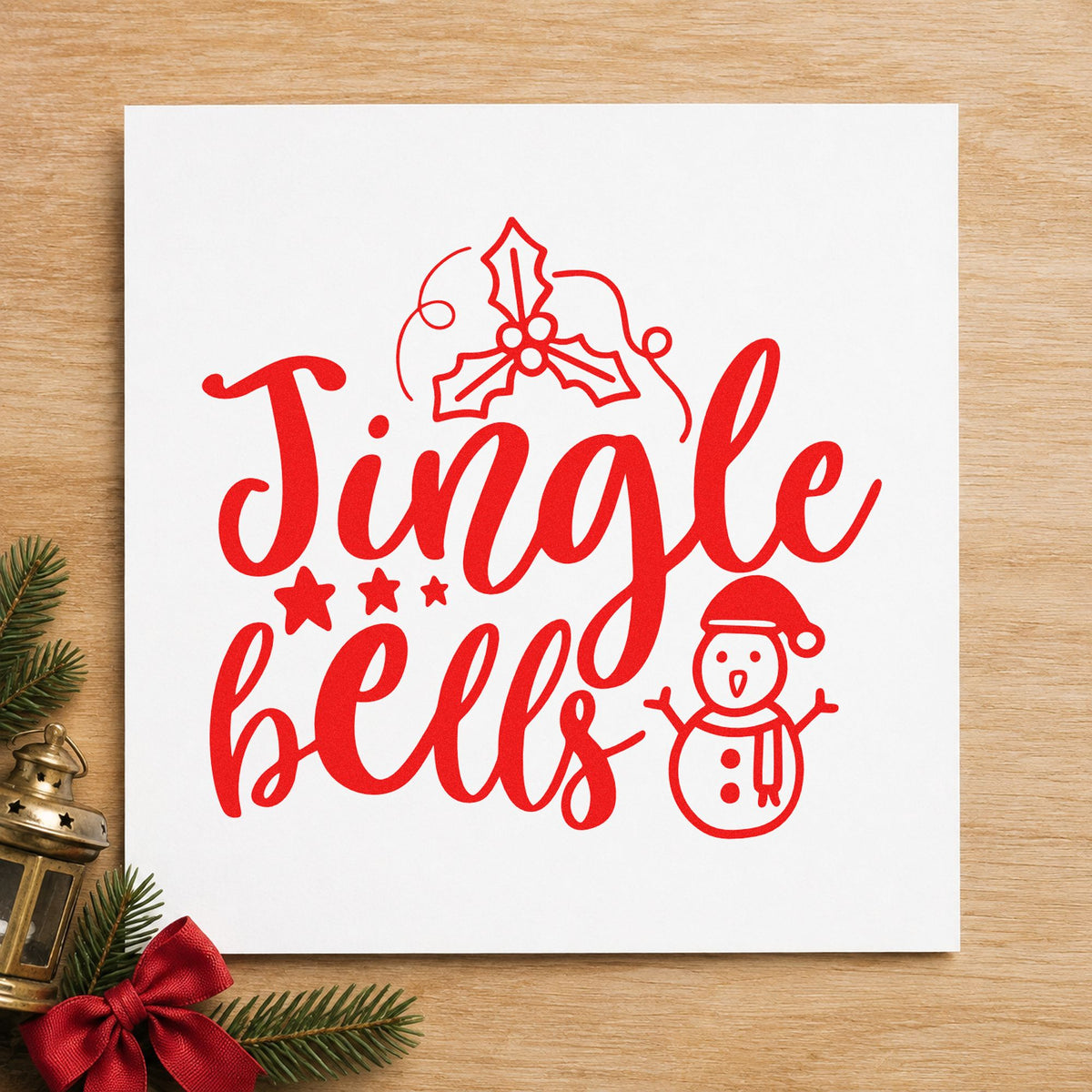 Jingle Bells Holly Snowman rubber stamp shown in red ink, stamped for projects such as lantern bin labels.