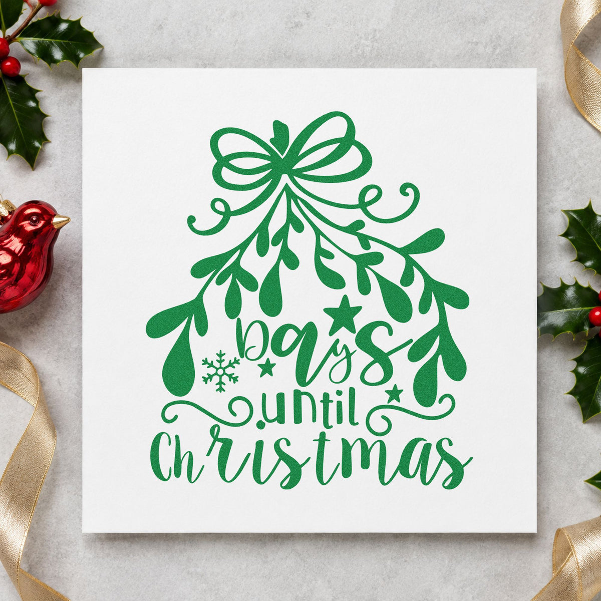 Days Until Christmas Mistletoe craft stamp imprint in green ink on a handmade project, one idea being window number signs.