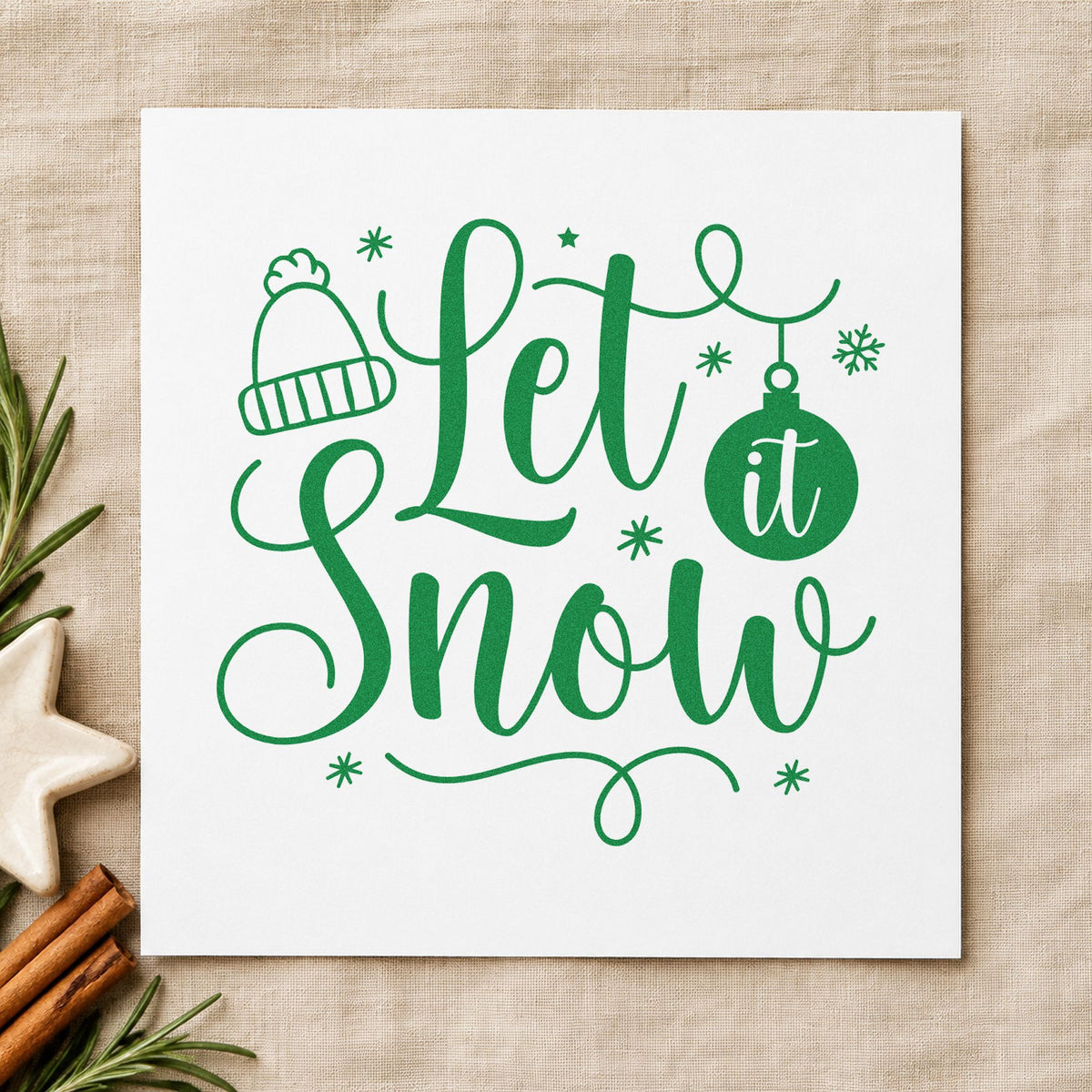 Let It Snow Winter Hat craft stamp imprinted in green ink on paper, a design suited to framed counter wall.