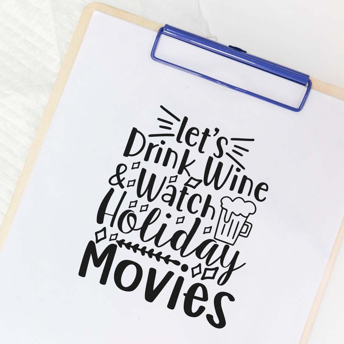 Wine And Holiday Movies Stamp - Premium Vintage Pro Wooden imprint stamped in black ink. The phrase "Let's drink wine & watch holiday movies" includes a frothy mug and decorative lines.
