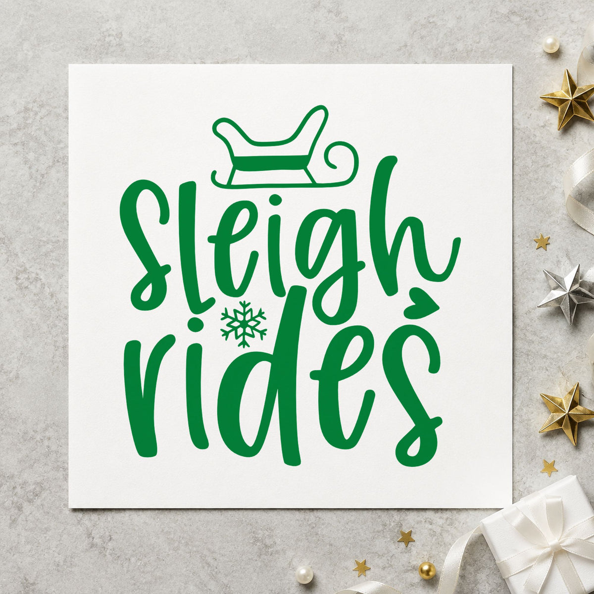 Sleigh Rides With Snowflake craft stamp imprinted in green ink on paper, a design suited to framed lobby alcove.
