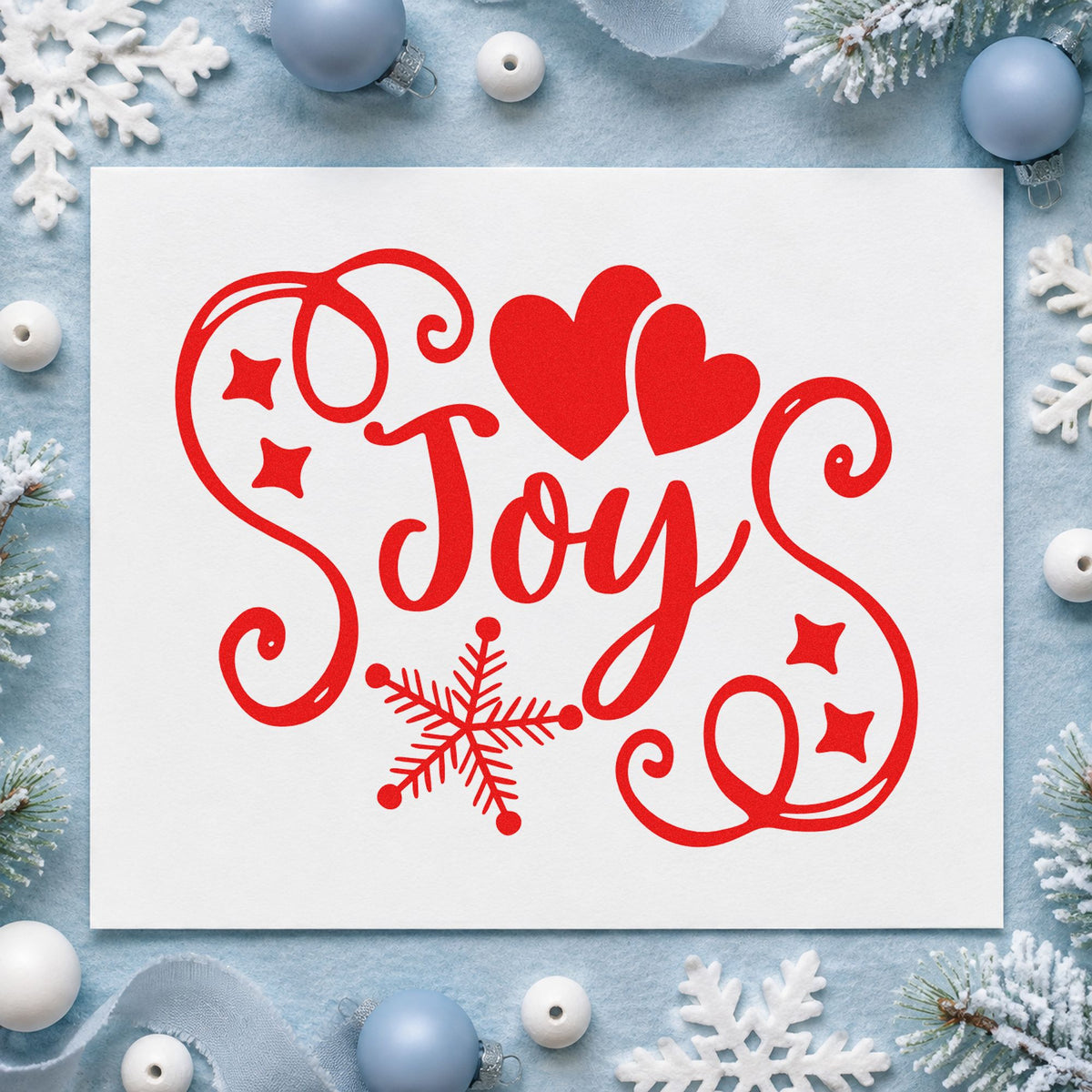 Joy Hearts Snowflake Flourish craft stamp in red ink on cardstock, an easy option for sampler hoop printing.